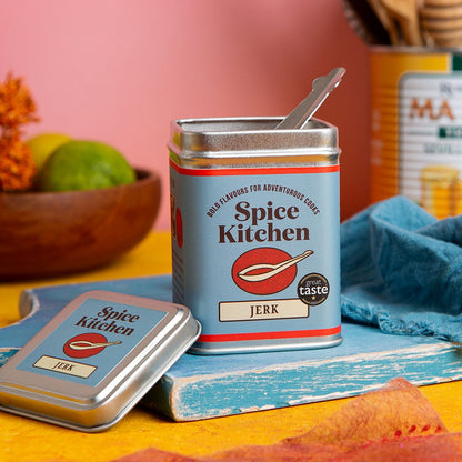 Spice Kitchen jerk spice can with a spoon on a colorful background