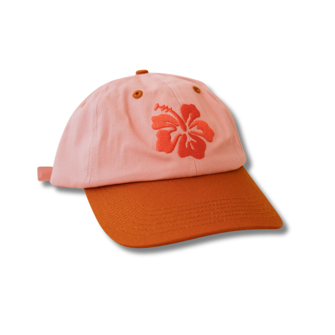 Pink and orange cap with a floral design on a white background