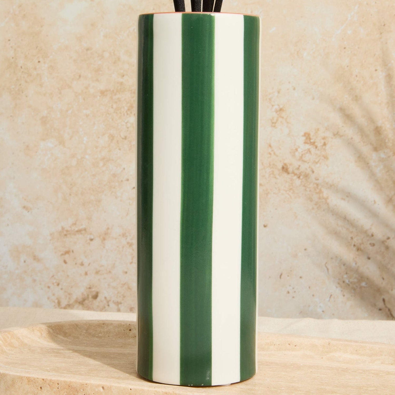 Reusable ceramic diffuser jar with olive striped design and luxurious oud leather scent