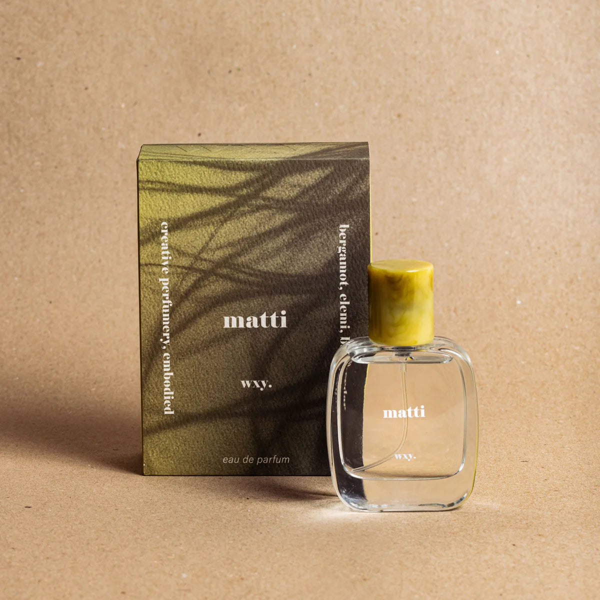 Matti Eau de Parfum bottle with the packaging  – fresh green and woody fragrance