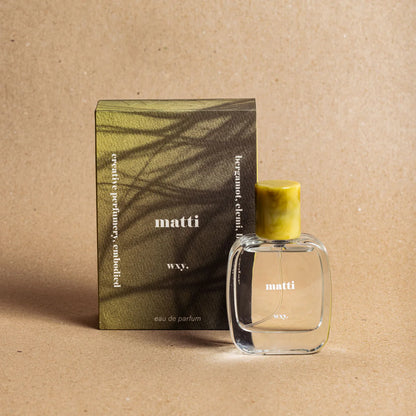 Matti Eau de Parfum bottle with the packaging  – fresh green and woody fragrance