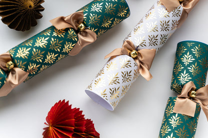 Close-up of the Opulent Christmas Crackers with gold leaf pattern and brown ribbon on a white background