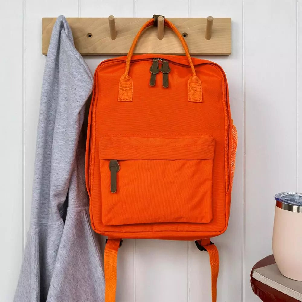 Compact everyday backpack in orange with adjustable straps and multiple compartments