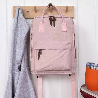 Compact everyday backpack in pink with adjustable straps and multiple compartments
