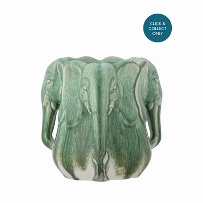 side view od the Handcrafted stoneware vase with sculptural elephant heads and green glaze
