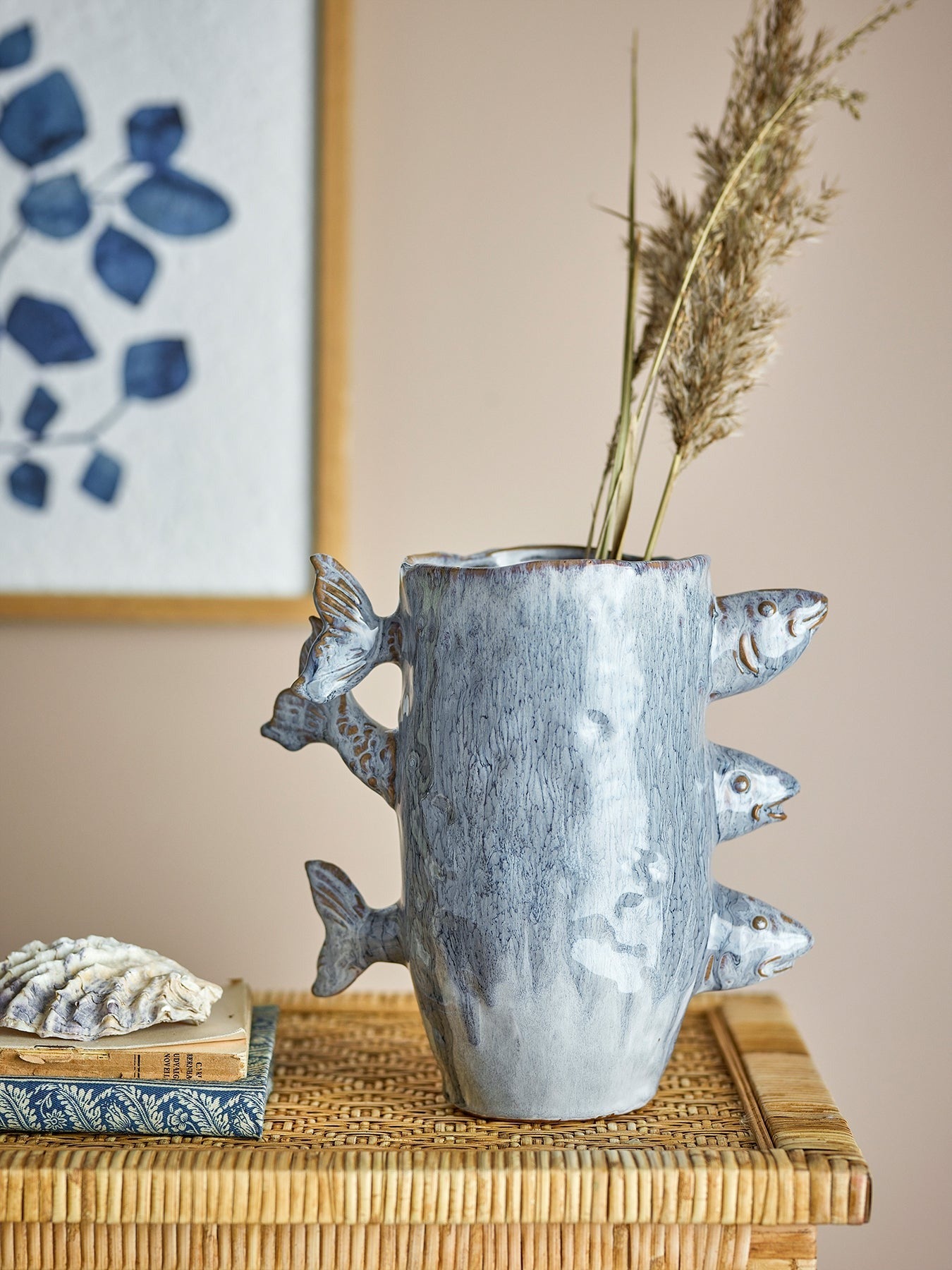 Stoneware fish vase with three decorative fish and blue reactive glaze with dried flower