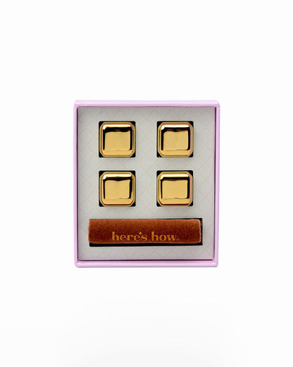 Stainless steel cocktail chillers set with four freezable cubes and brown storage pouch inside display box
