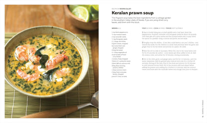 Keralan prawn soup in a bowl with a recipe on the side.