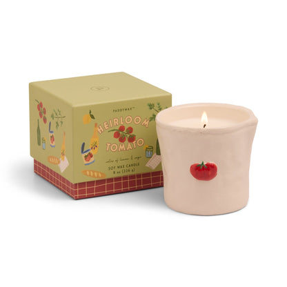 Tomato embossed 8oz ceramic candle with hand-painted tomato icons, emitting fresh savory and herbaceous fragrance, from the Bistro Collection, packaged in a charming sliding box.