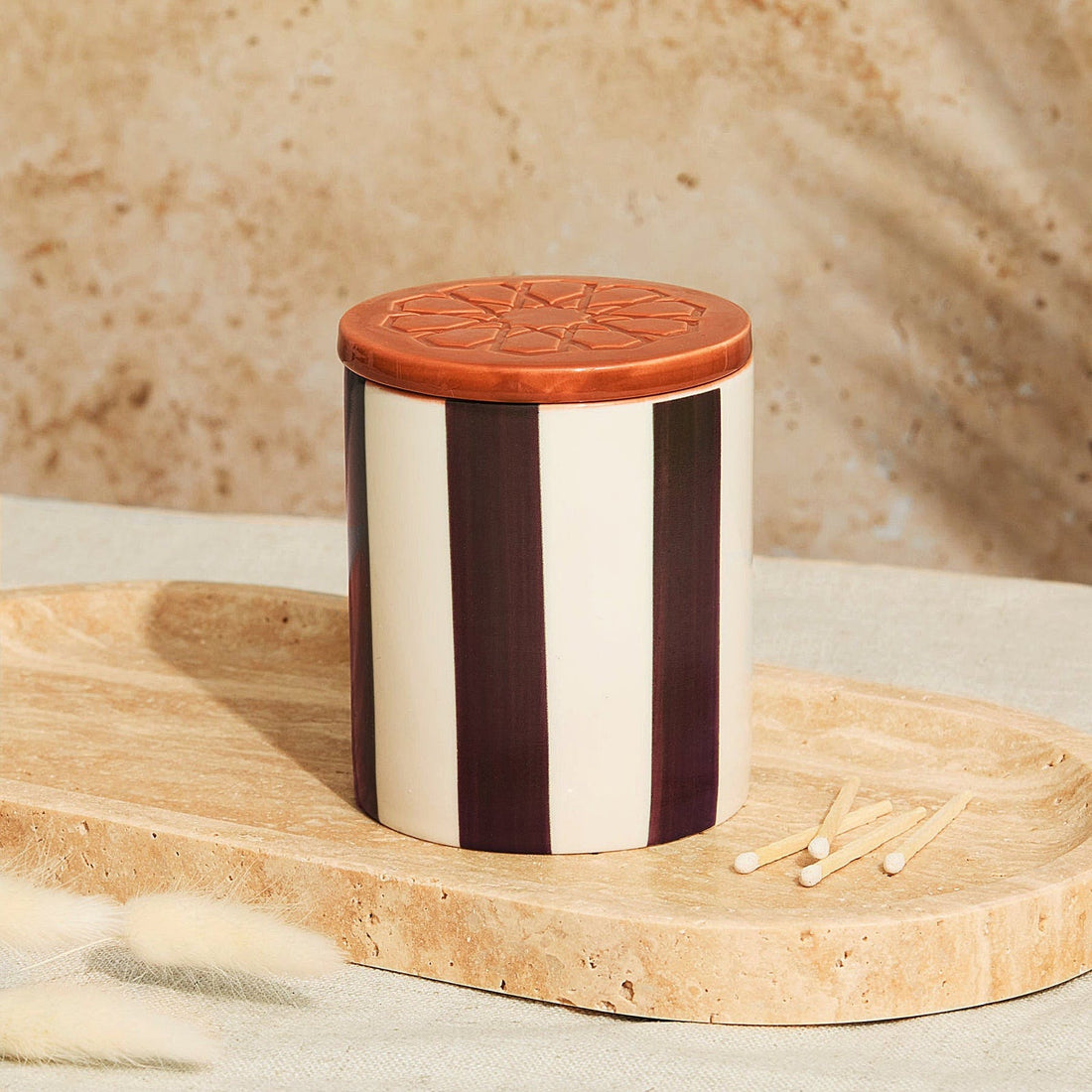 Marrakesh Chocolate Stripe Candle in ceramic vessel with lid and tomato leaf fragrance