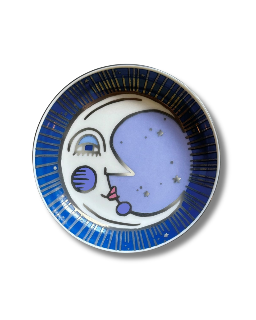 Top view of a round Moon Porcelain Trinket Dish, featuring a vibrant hand-painted moon design with a silver-lined edge, crafted from ceramic.