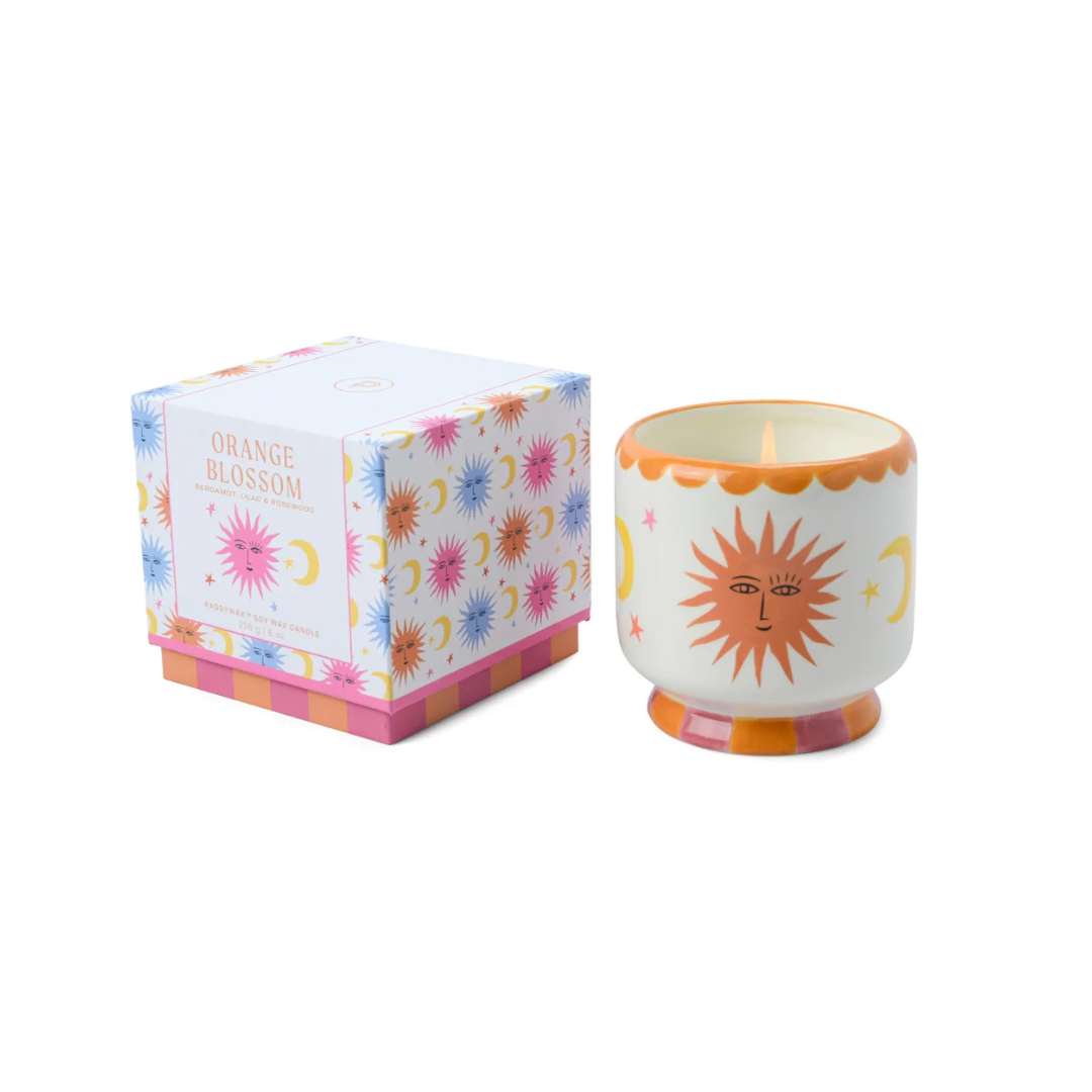 Vegan cruelty-free soy wax candle, 8oz, in a repurposable ceramic jar with orange sun , moon and stars decoration, featuring a orange blossom fragrance