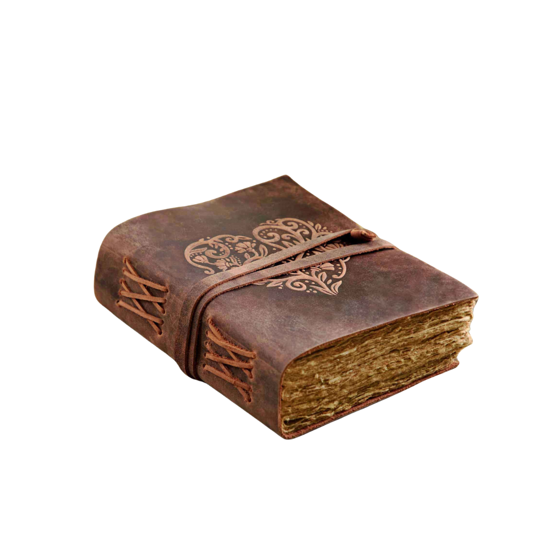Heart Buffalo Leather Wraparound Journal with embossed heart, leaves, and flowers on the cover, thick unlined dyed khadda paper with deckled edges, and wraparound leather closure.