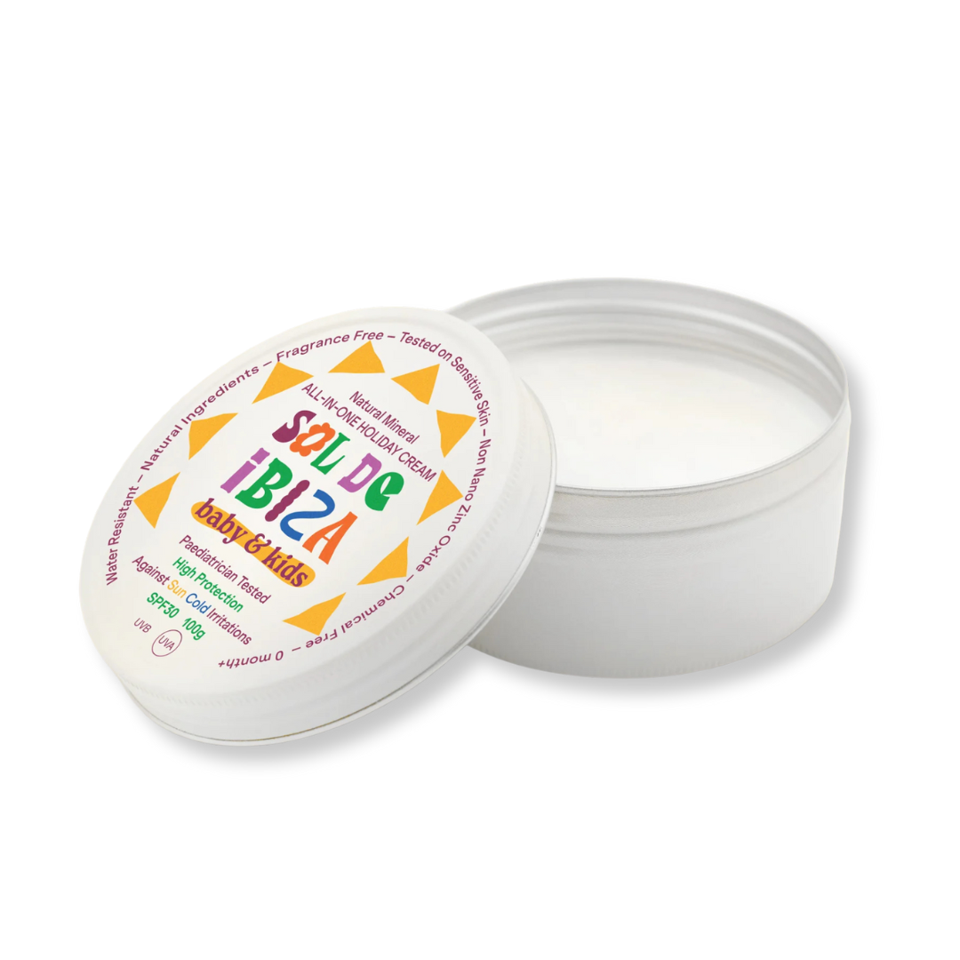 Open container of Sol de Ibiza baby & kids cream with colorful label on a white background