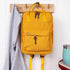 Compact everyday backpack in yellow with adjustable straps and multiple compartments