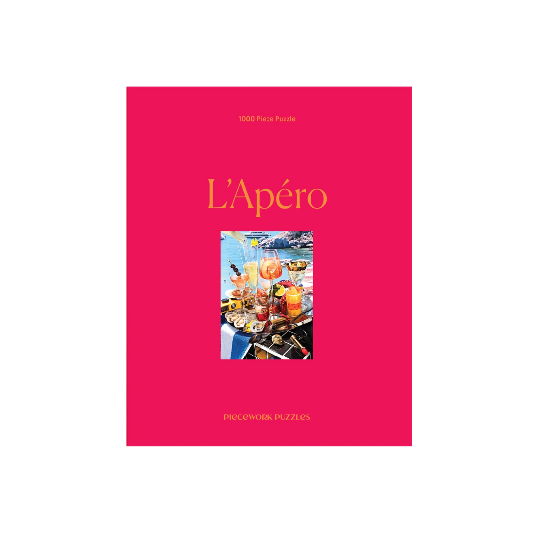 Puzzle box with pink cover featuring an image of a aperol by the Italin sea and &