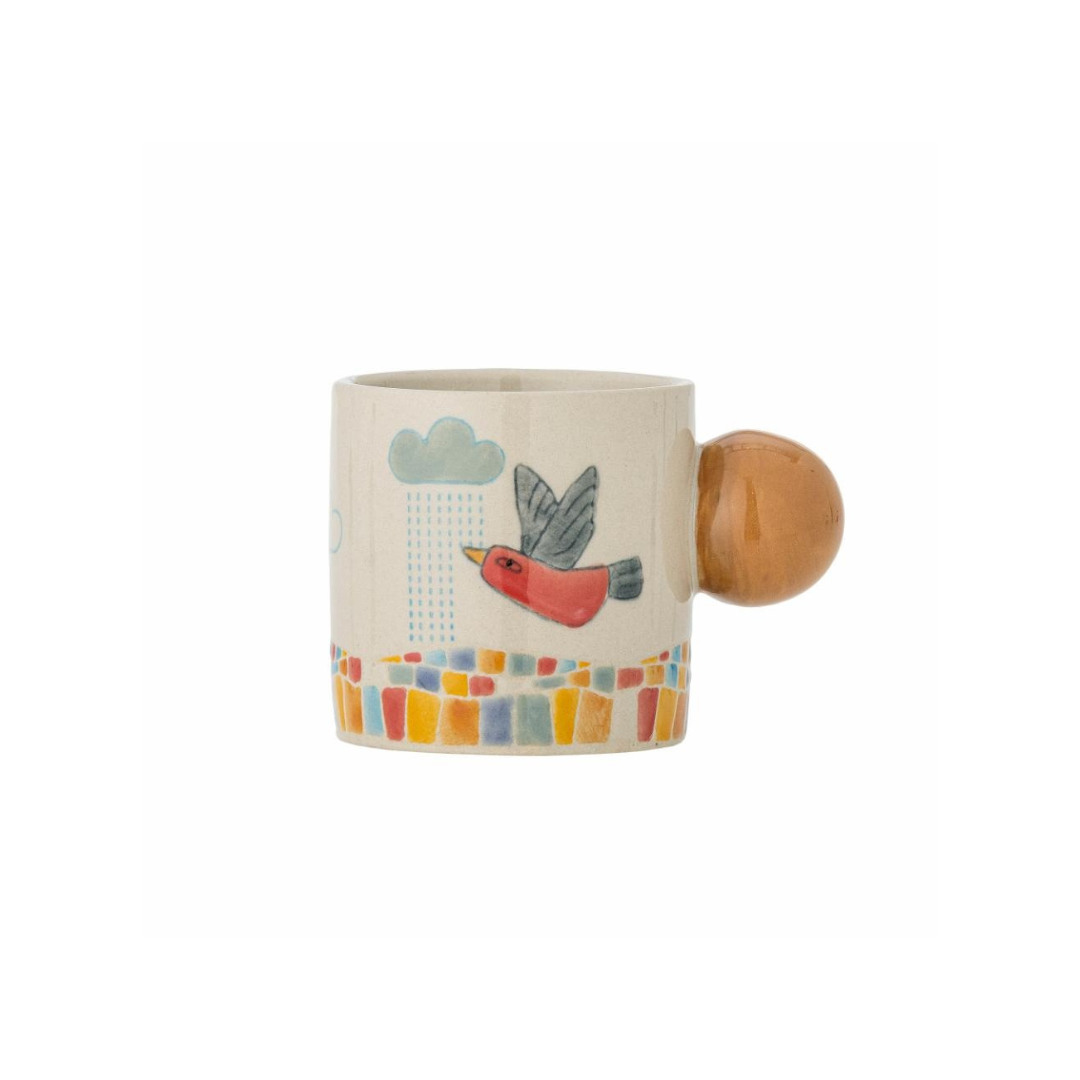Ceramic mug with a round handle featuring a bird design on a white background