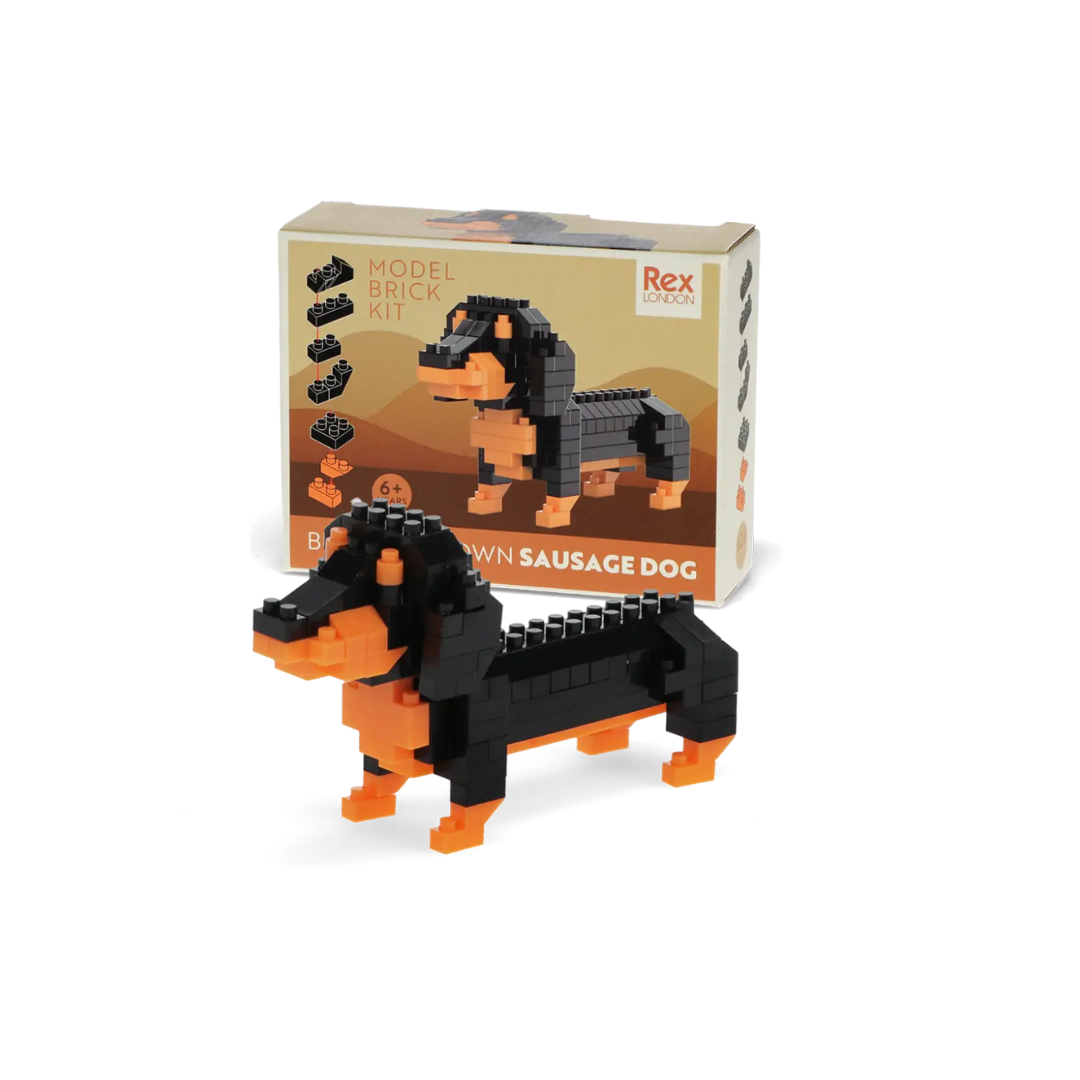 Model brick kit of a sausage dog with packaging in the background