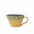 Handcrafted ceramic cup with a reactive yellow and blue glaze, featuring pearlescent shimmer highlights. Ideal for coffee, tea, or display.
