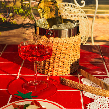 Red tomato-shaped linen cocktail  napkins on a table