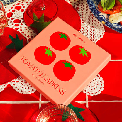 Set of four tomato-shaped linen cocktail napkins in a playful and sustainable box with tomato illustrations.